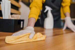 front-view-barista-cleaning-table (1)